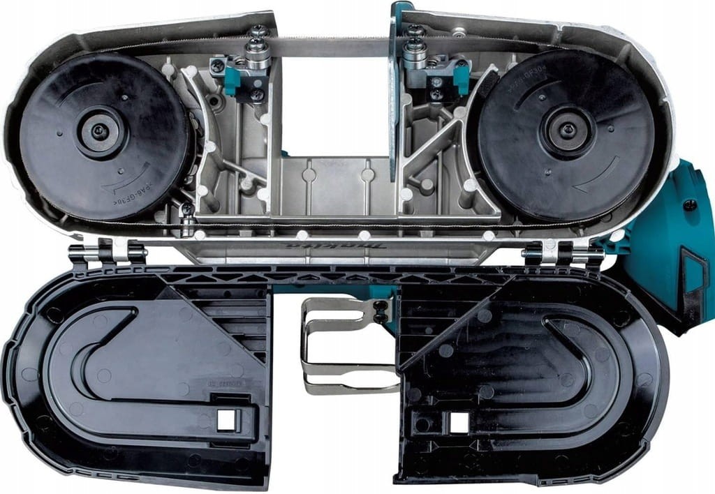 Makita DPB182Z wnętrze przecinarki taśmowej 18V – koła prowadzące i mechanizm prowadzenia taśmy