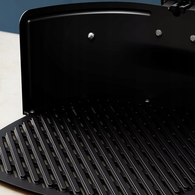 Zbliżenie na żebrowaną powierzchnię non-stick płyty grillowej Philips